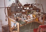1982: This is my electronics bench/ham shack in Rochester, NY. I put it next to the cold water entry and had a really good earth ground for radio work. It was, of course, a horrible mess at all times.