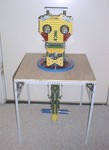 4/97: RAD on his storage table, so you can see the control pillar beneath his head.