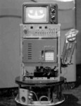 1978: Cosmo Klein, a COSMAC-controlled robot with radio control and a fully functional arm with gripper. Cosmo and I appeared on TV, in Look Magazine, and in numerous newspapers from the late 70s to the early 80s.
