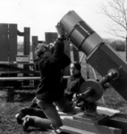 1970: I'm focusing George Hodous' SLR at the suitably filtered sun, with Ben Kuehlhorn looking on.